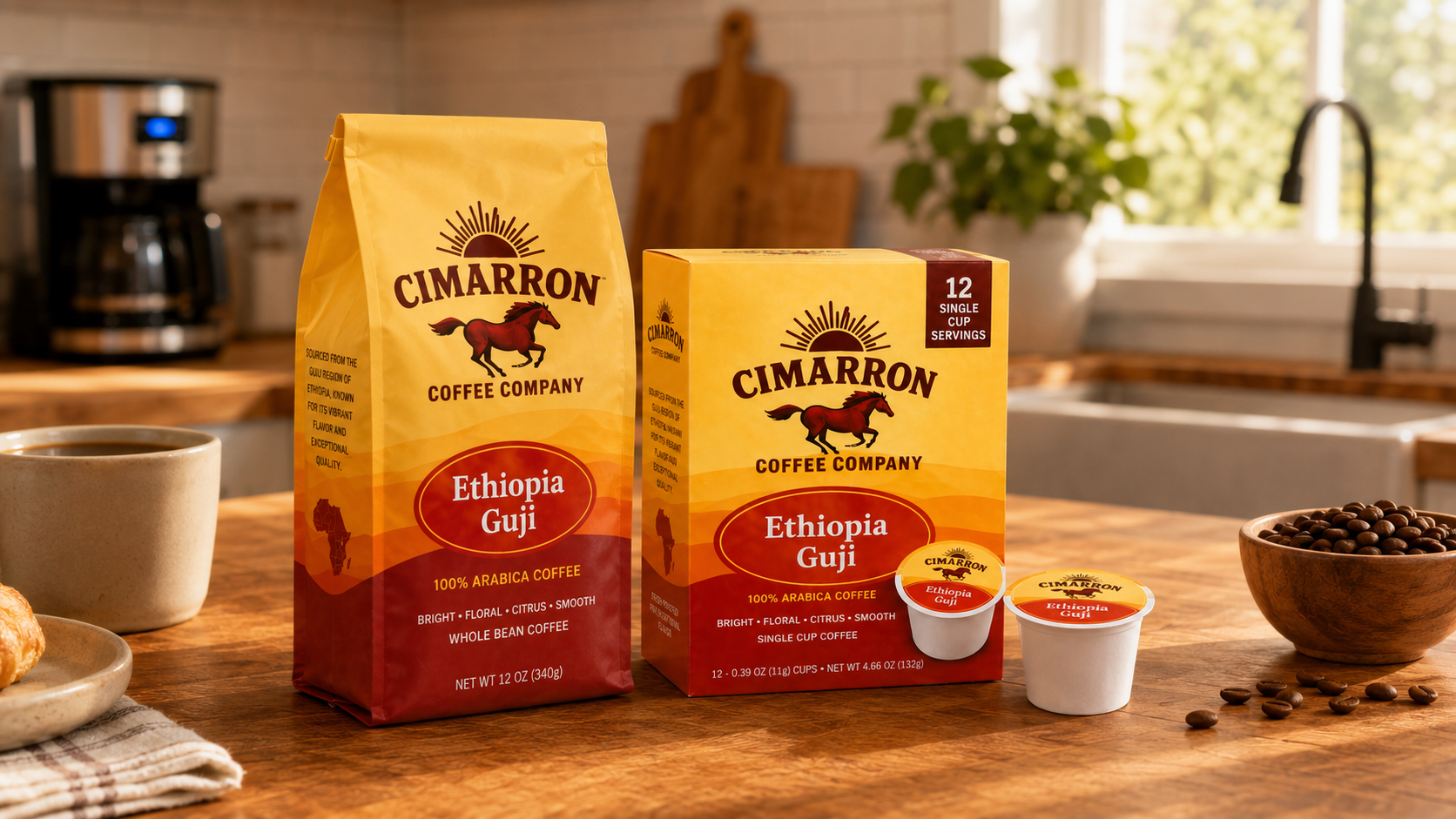Single serve coffee cup beside a full Cimarron Coffee bag on a kitchen counter.